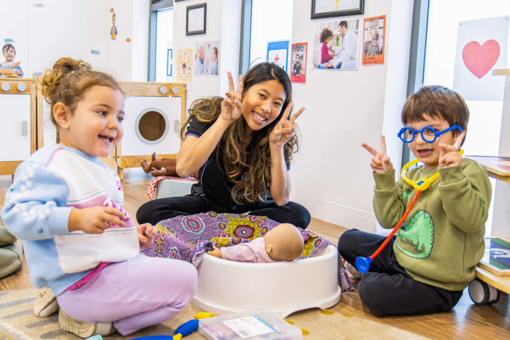 Children and educator playing in a classroom